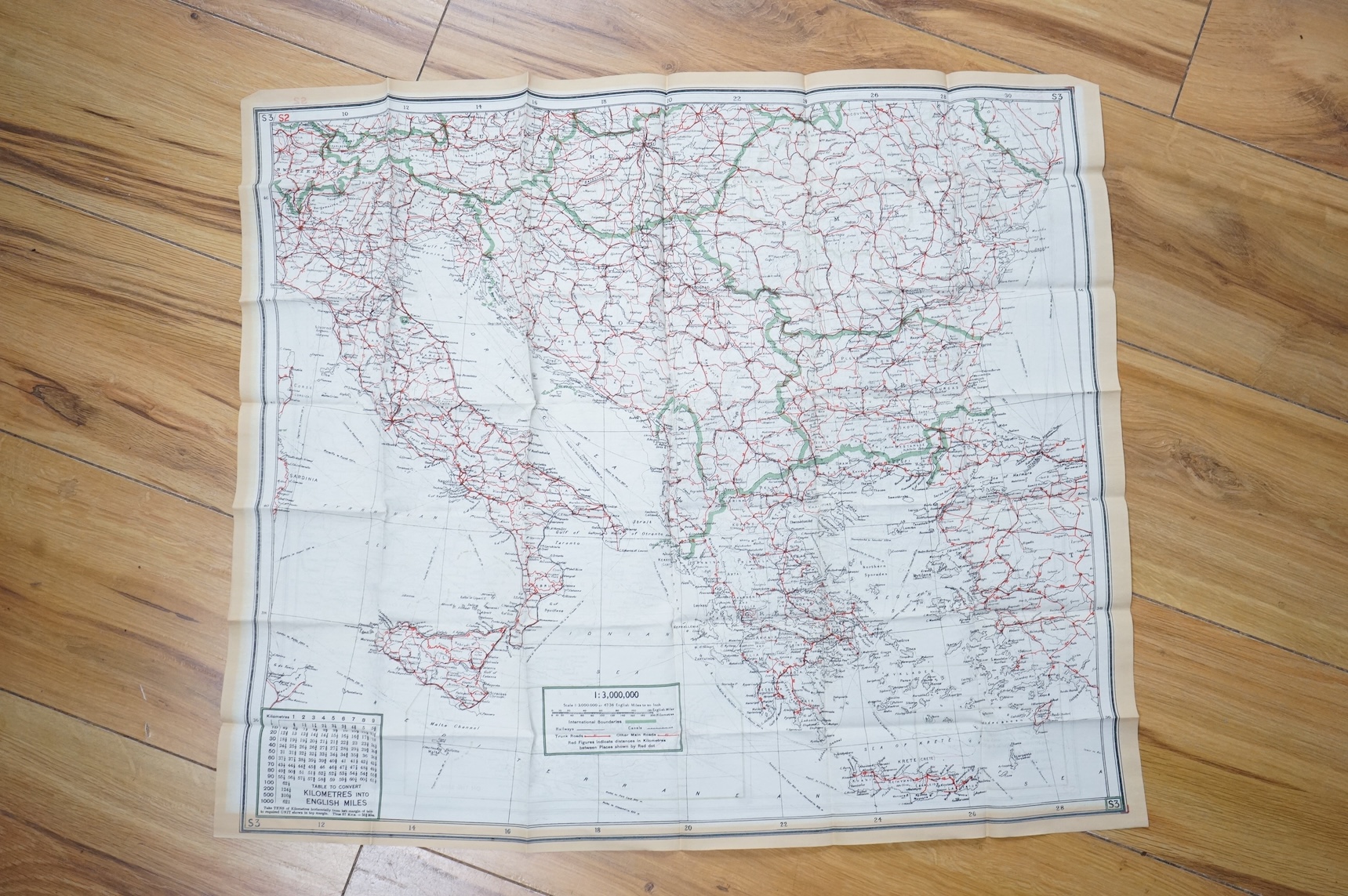 Four ‘escape’ style maps printed on silk type material, three printed double-sided; North Norway, 47x49cm, parts of Italy and Greece, 53x62cm, parts of France, 44x53cm, and a single sided map of part of the Mediterranean